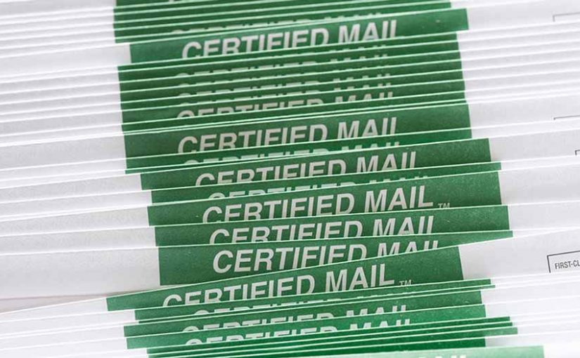 A tightly stacked row of Certified Mail envelopes is shown from a side angle, each marked with a bold green label that reads “CERTIFIED MAIL.” The repeated pattern emphasizes volume and consistency, representing a high-volume, professional mailing operation. The image reflects the assurance and authority of Postalocity’s certified mail services, which simplify the process of sending legal, financial, or official documents that require tracking, compliance, and proof of delivery. It visually communicates security, reliability, and the importance of document integrity when using Postalocity’s seamless online mailing platform.