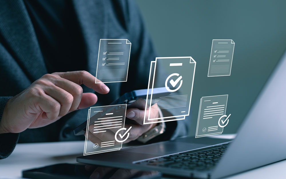 A person in a dark blazer uses a smartphone and laptop simultaneously, with digital icons of check-marked documents floating around the scene. These transparent overlays represent successfully completed and verified forms, symbolizing accuracy, compliance, and documentation. The image conveys the importance of maintaining legal standards in sensitive communications. For credit repair professionals, it reflects how Postalocity’s secure mailing platform ensures dispute letters and client notices meet regulatory requirements while offering audit trails, error reduction, and peace of mind with every piece of mail sent.