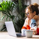 woman on laptop mailing from anywhere